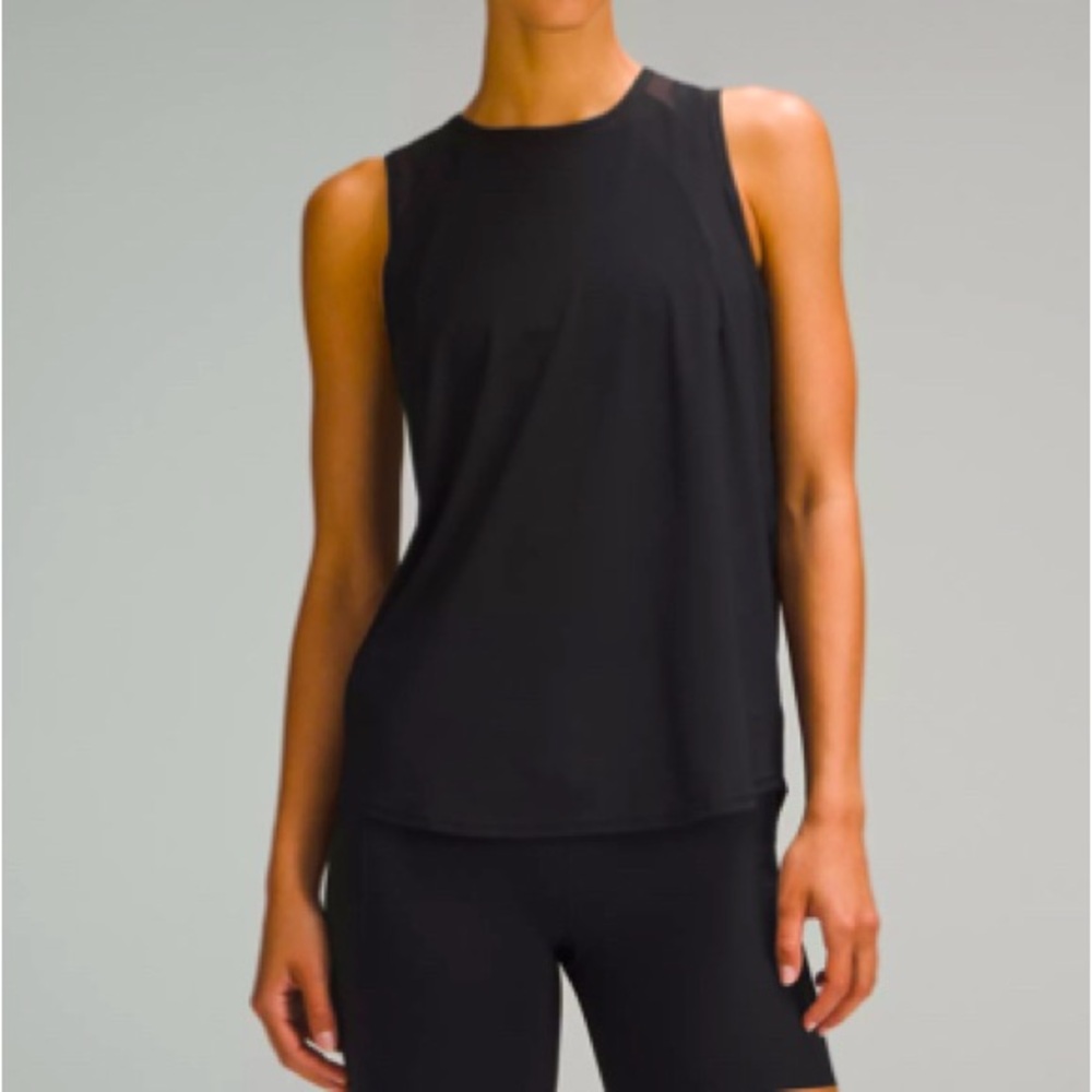 $58 Lululemon sculpt tank. Black. Size 6. Sheer detail on back. EUC.